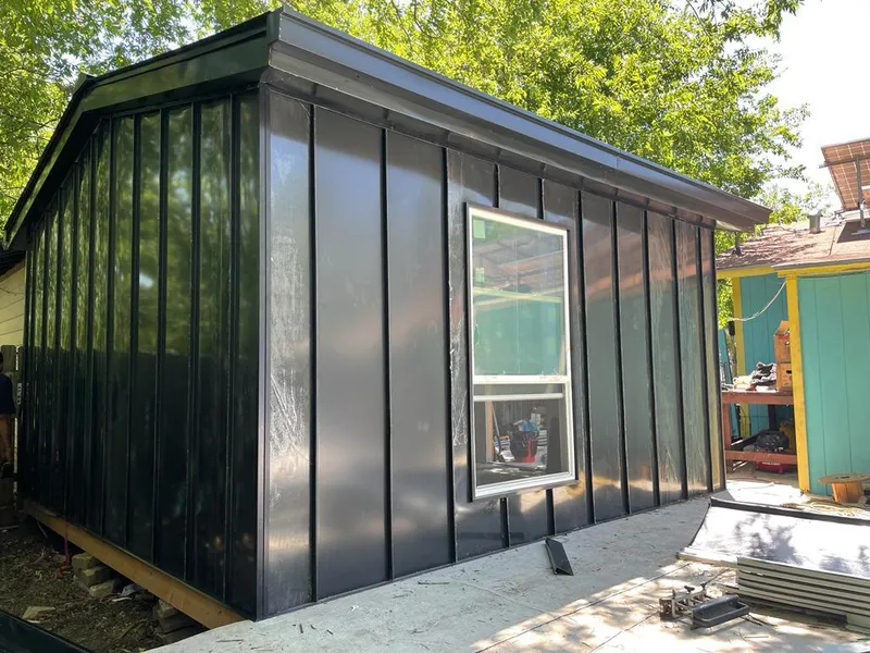 Black standing seam metal wall panels for Roof Inspection in Henrietta