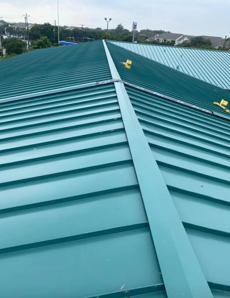 Green commercial metal roof ridge and valley for Metal Roof Repair in Henrietta